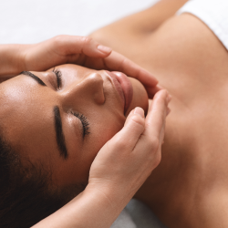 Woman lying down, getting a facial at a Tampa medical spa